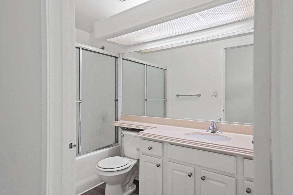 Bathroom with Bathtub and Vanity with Cabinet Storage