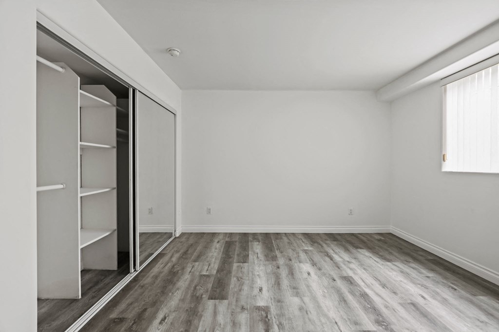 Bedroom with Large Closet with Built-In Organizers