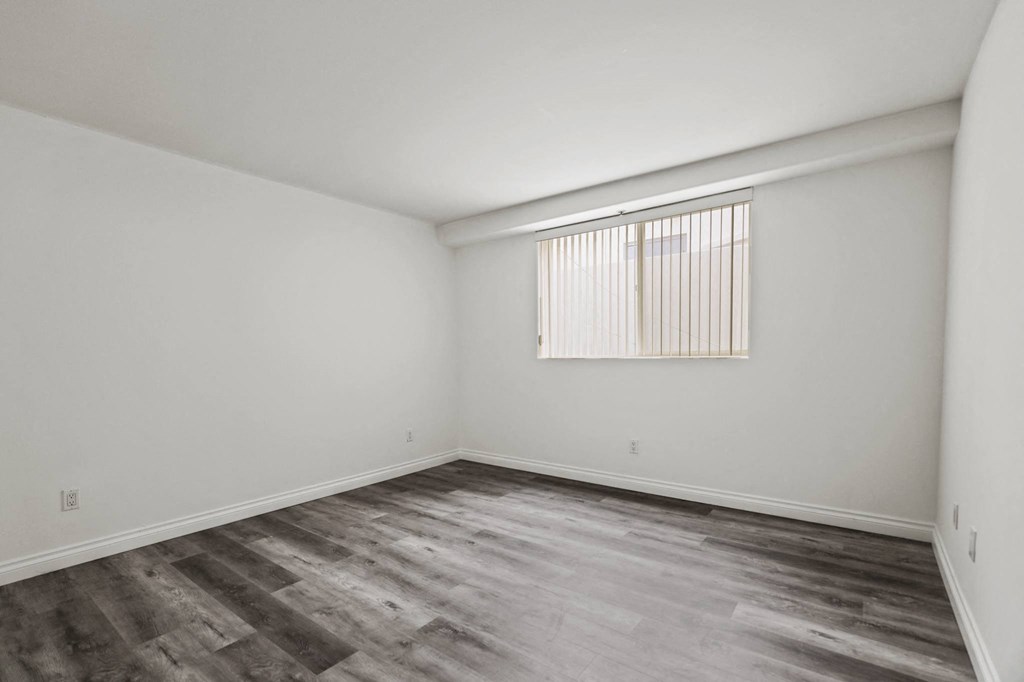 Large-Size Bedroom with Vinyl Flooring and Windows