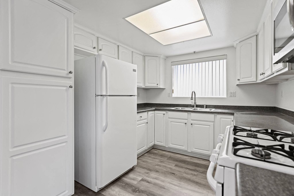 Kitchen with Appliances and Ample Cabinet Storage