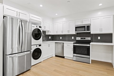 Open-Concept Kitchen with Energy-Efficient Appliances and In-Suite Washer & Dryer