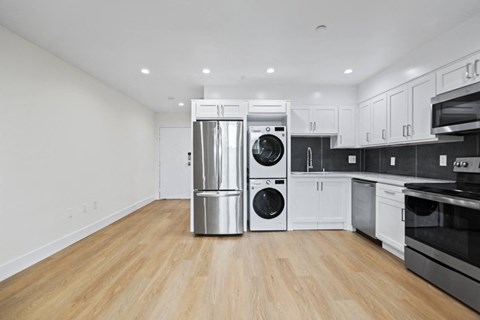 Open-Concept Kitchen with Energy-Efficient Appliances and In-Suite Washer & Dryer