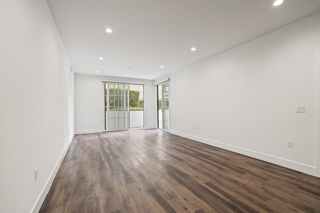 Living Room with Recessed Lighting, Vinyl Flooring, and Patio with Custom Shades