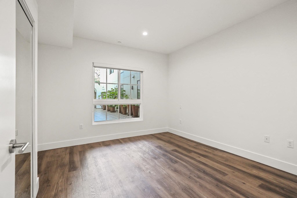 Bedroom with Recessed Lighting, Vinyl Flooring, Large Window