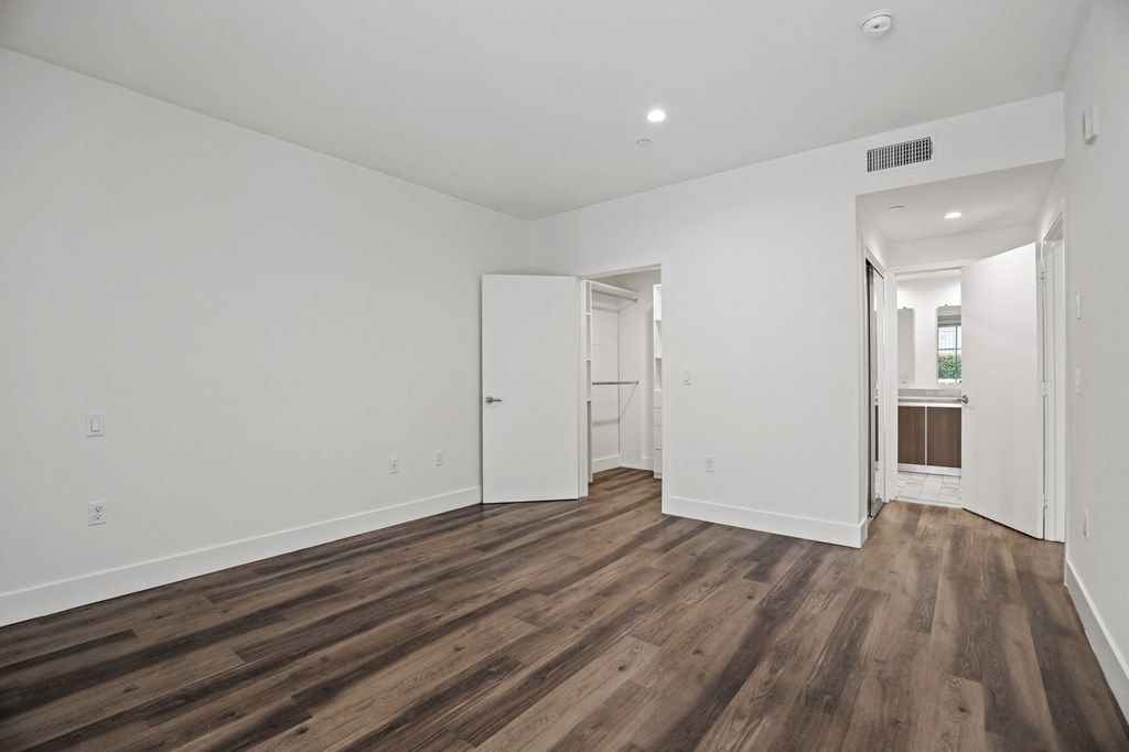 Bedroom with Closet, Bathroom, Recessed Lighting, and Vinyl Lighting