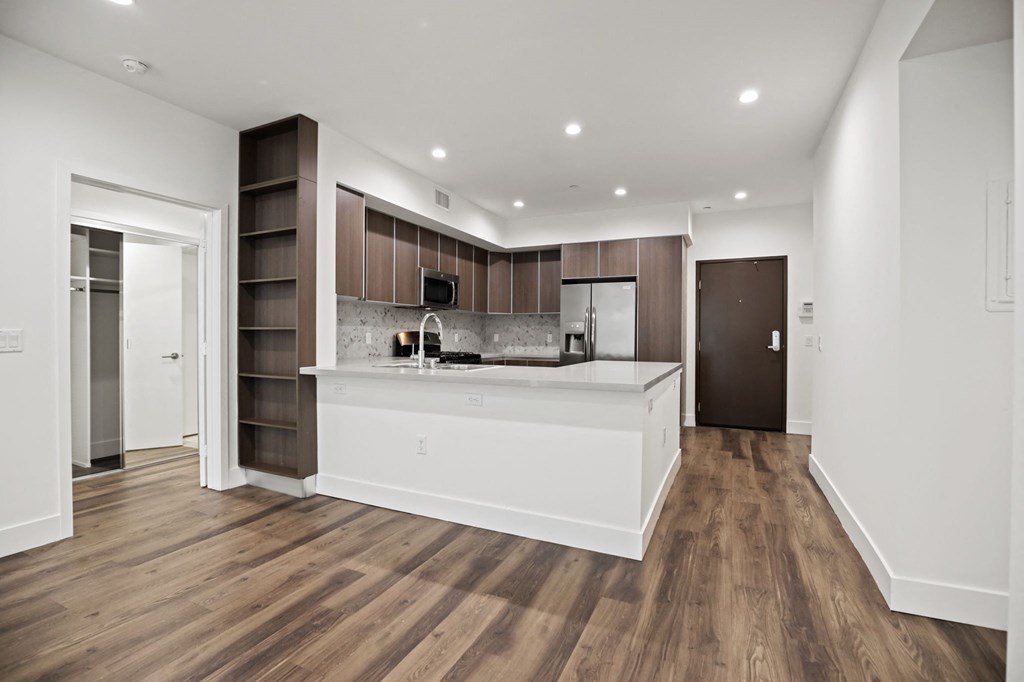 Kitchen and Dining Area with Recessed Lighting and Vinyl Flooring