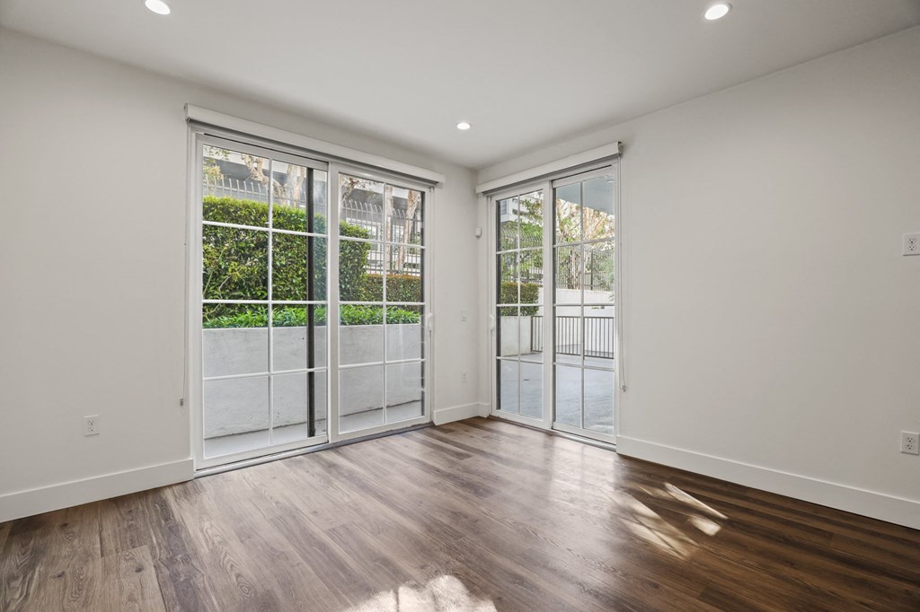 Living Room with Patio, Recessed Lighting, and Vinyl Flooring