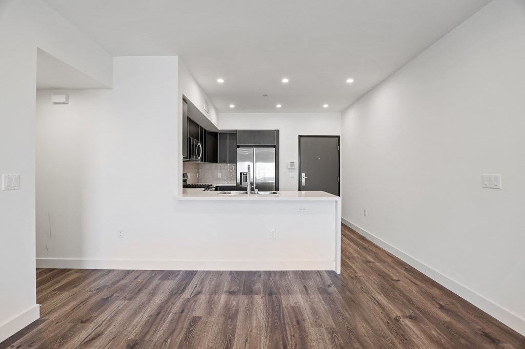 a kitchen and dining area in a 555 waverly unit