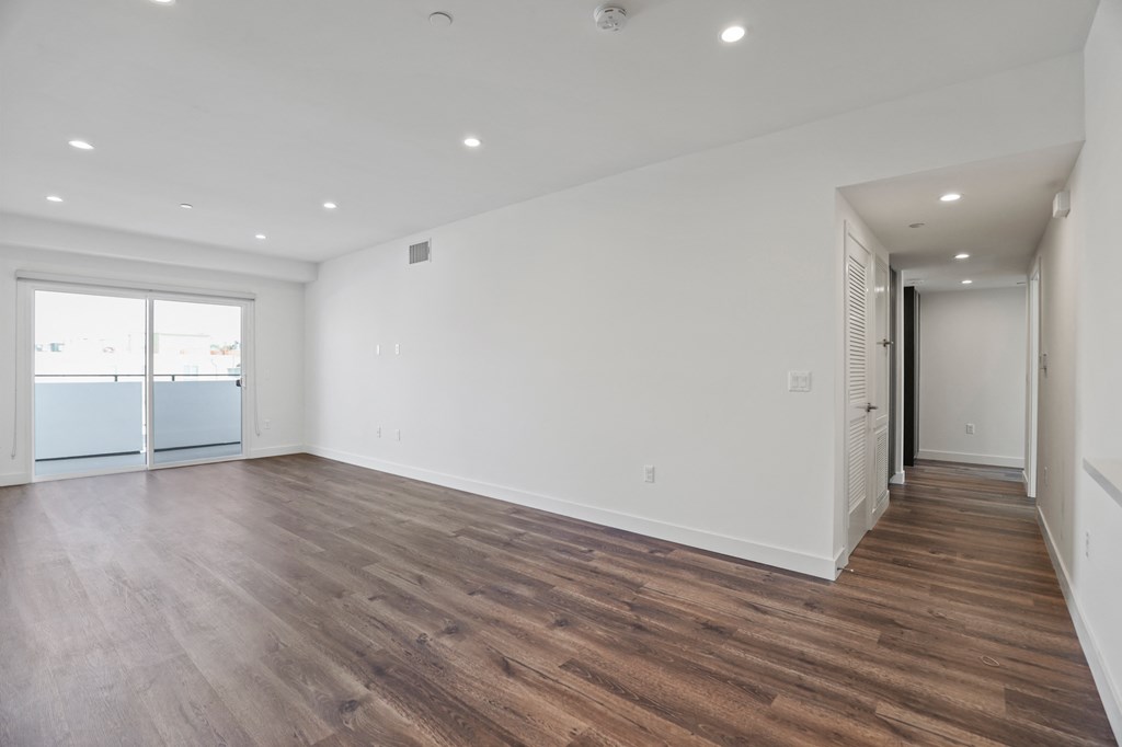 Large-Size Living Room with Recessed Lighting, Vinyl Flooring, and Patio