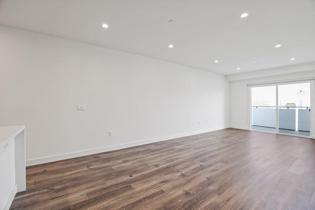 Large-Size Living Room with Recessed Lighting, Vinyl Flooring, and Patio