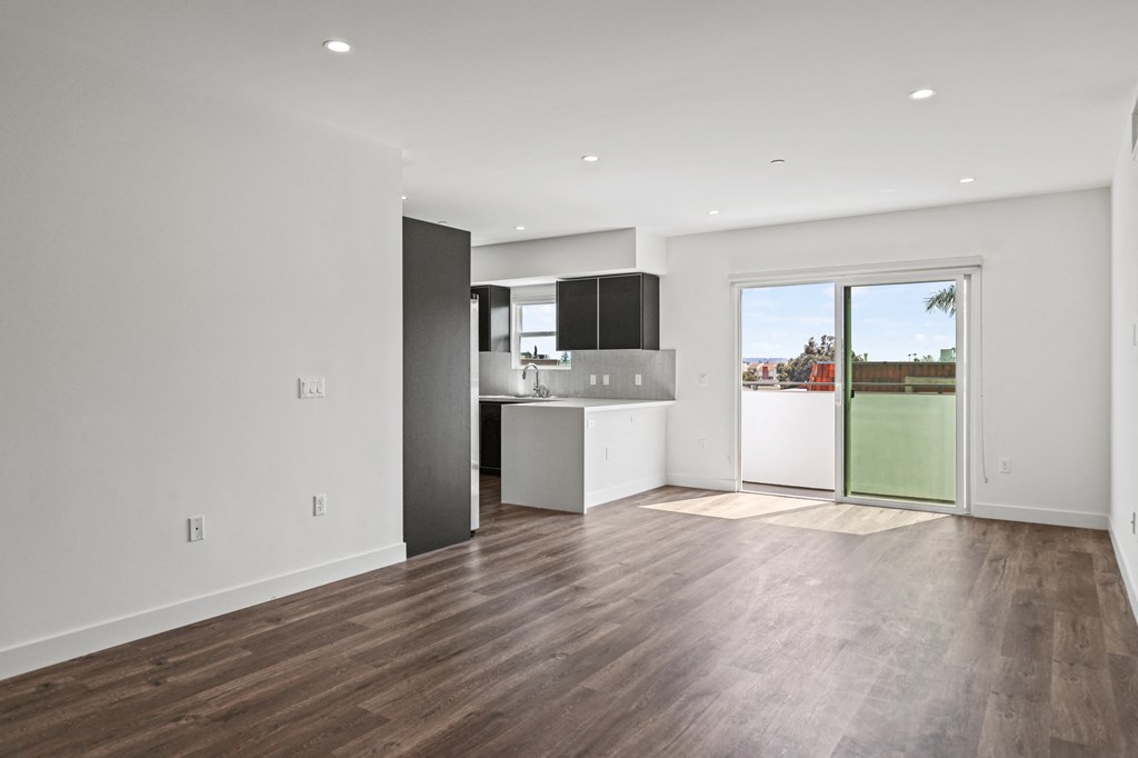a kitchen and living room in a 555 waverly unit