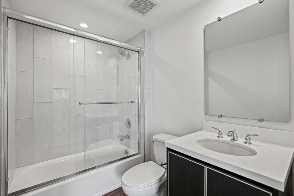 a bathroom with a bathtub toilet and sink