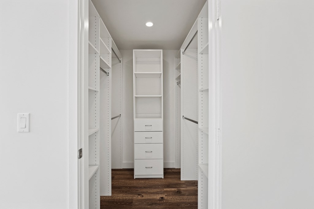 a walk in closet in a 555 waverly unit