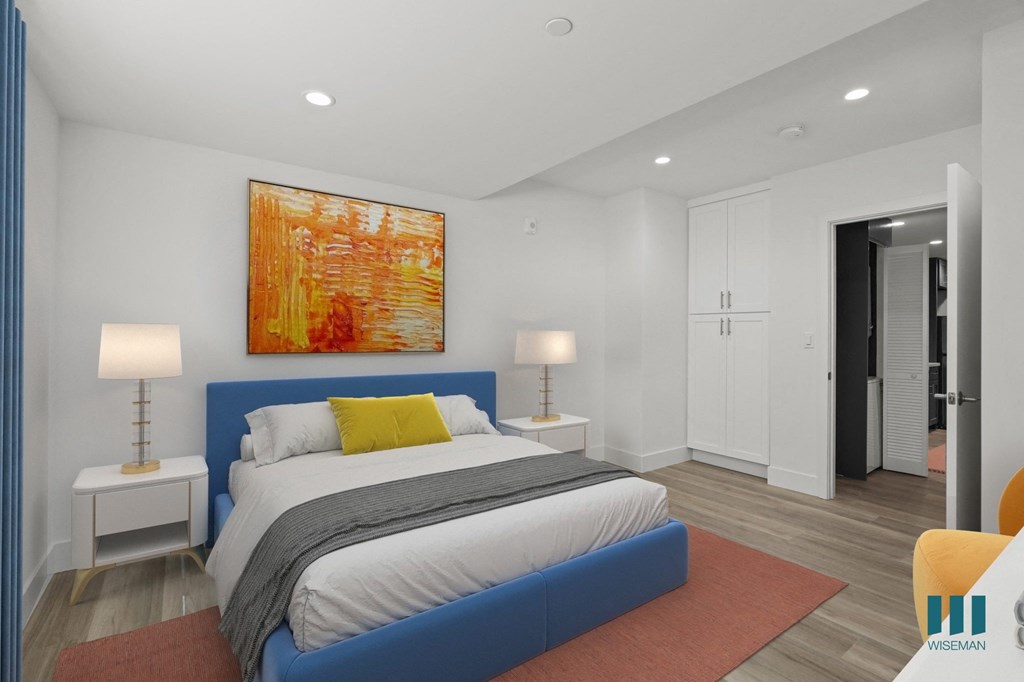 Bedroom with Built-In Cabinet Storage and Vinyl Flooring
