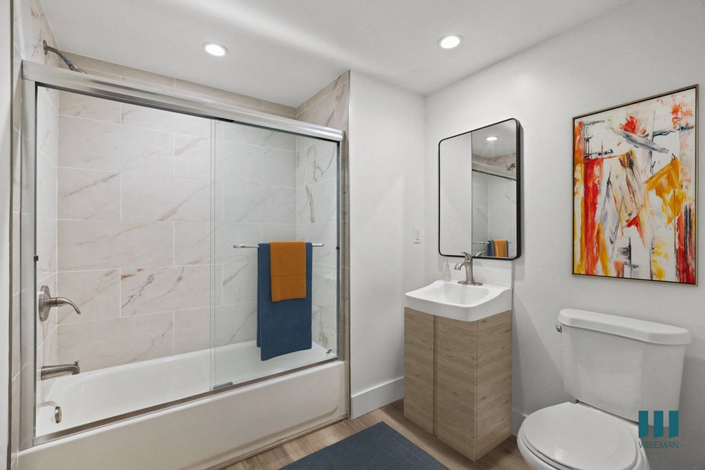 Bathroom with Shower Bath with Glass Door and vanity Cabinet Storage