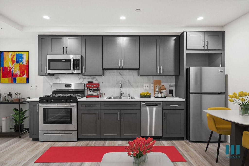 Kitchen with Stainless-Steel Refrigerator, Stove, Microwave Oven, and Dishwasher