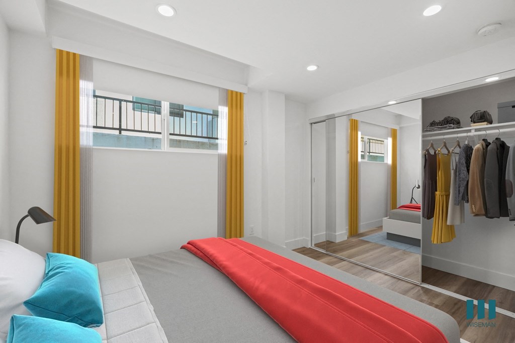 Bedroom with Large-Size Mirrored Closet with Shelving