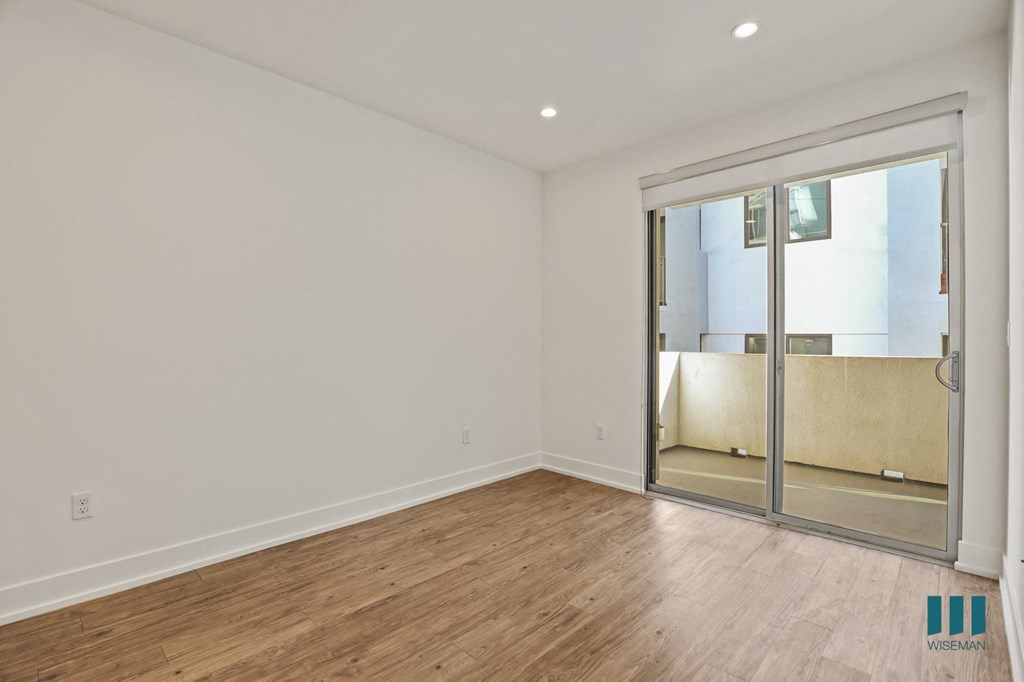 Living Room with Large-Size Windows, Patio, Recessed Lighting, and Vinyl Flooring