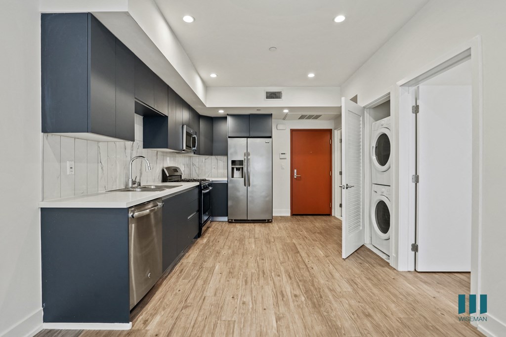 Kitchen with Energy-Efficient Appliances and In-Suite Washer & Dryer