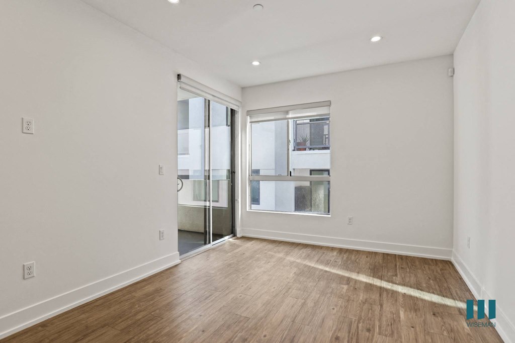 Living Room with Large-Size Windows, Patio, Recessed Lighting, and Vinyl Flooring