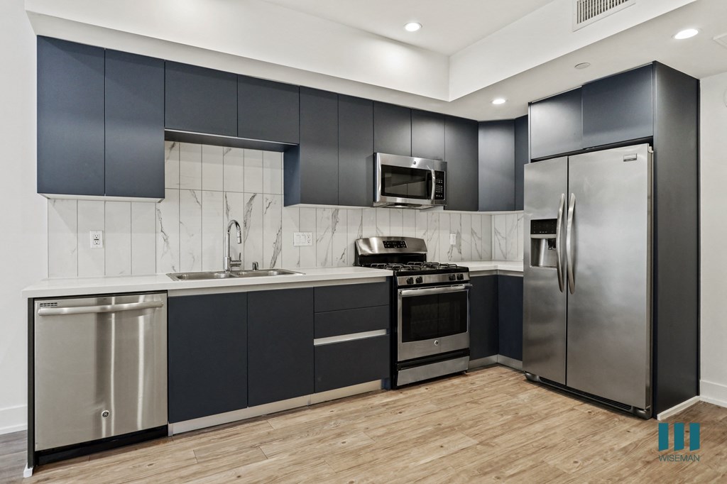 Kitchen with Stainless-Steel Refrigerator, Stove, Microwave Oven, and Dishwasher