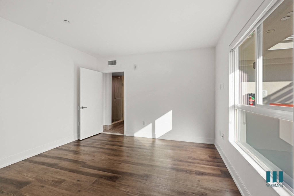 Bedroom with Recessed Lighting, Vinyl Flooring, and Large Windows