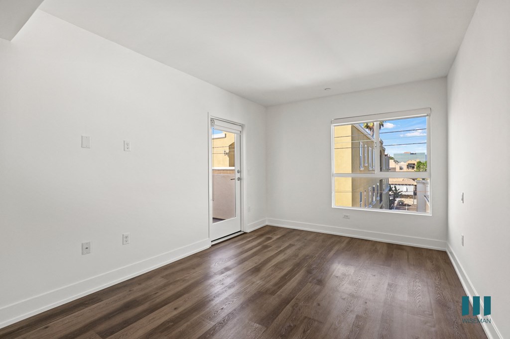 Living Room with Vinyl Flooring, Recessed Lighting, and Patio