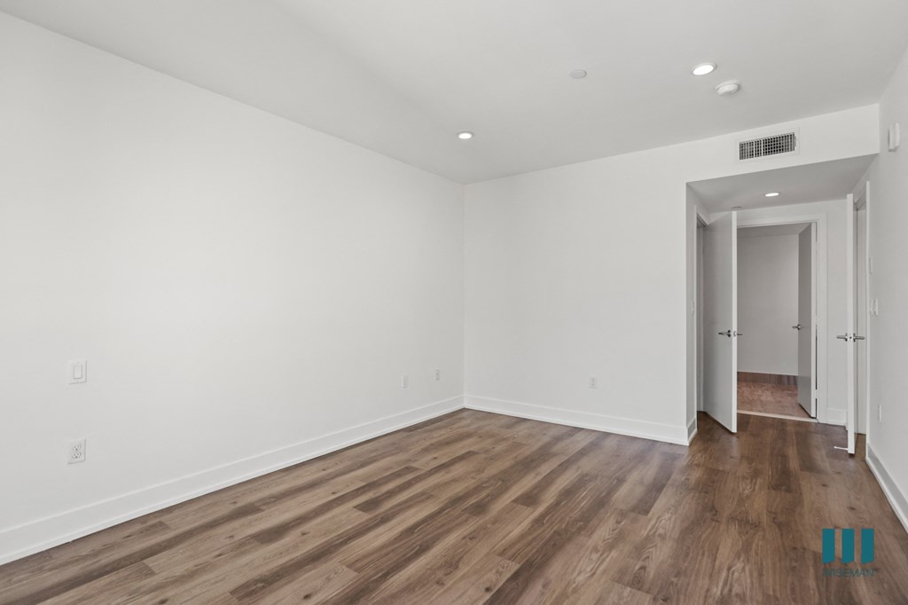 Bedroom with Vinyl Flooring, Recessed Lighting, and Bathroom
