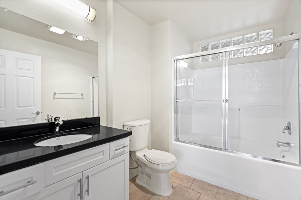 Bathroom with Bathtub and Cabinet Storage