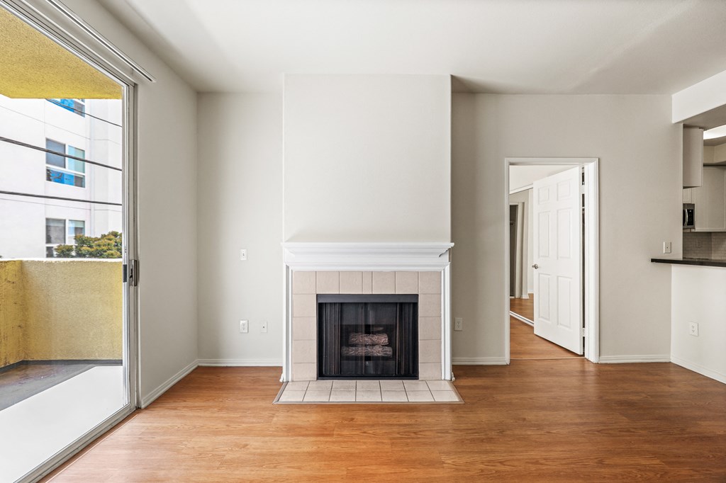 Living Room with Electric Fireplace and Patio