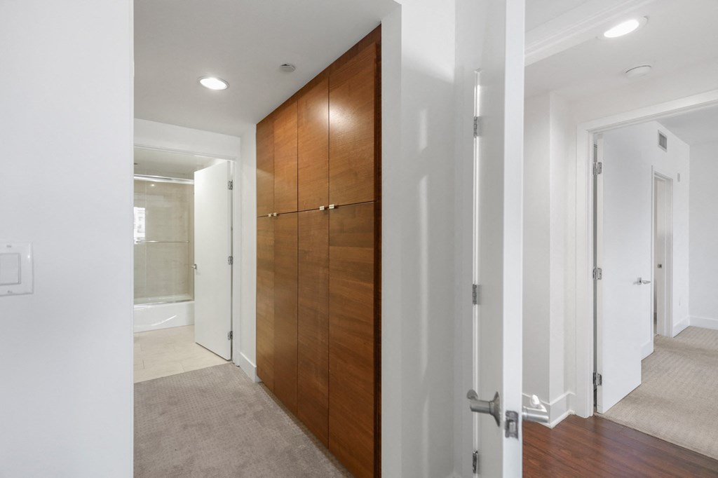 Bedroom with Bathroom and Built-In Cabinet Storage