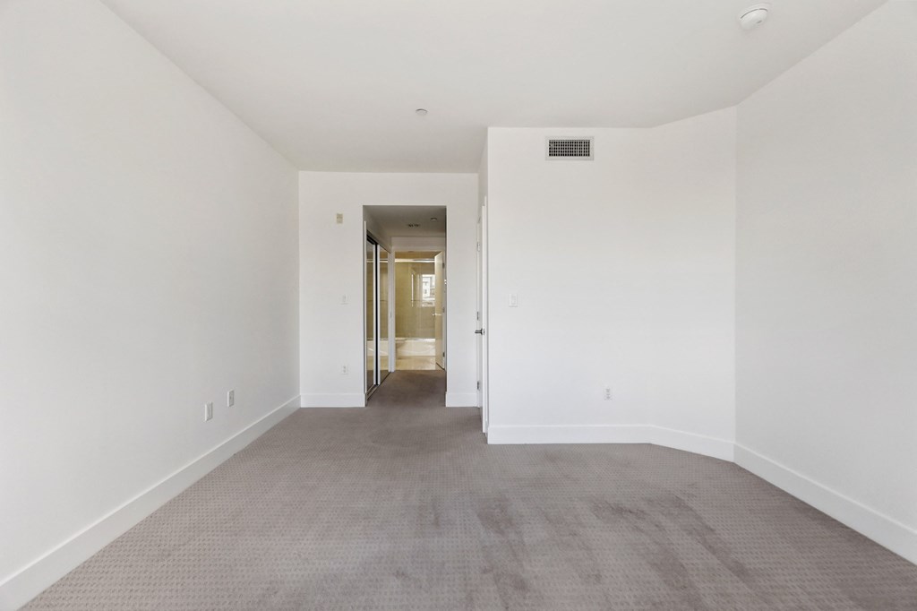 Bedroom with Mirrored Closet and Bathroom