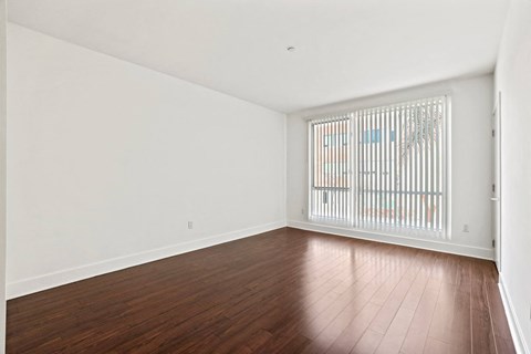 Bedroom with Vinyl Flooring and Large Windows