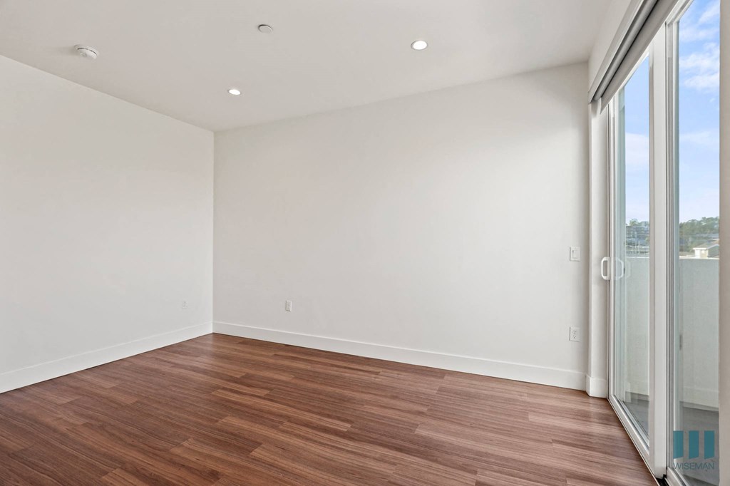 Living Room with Recessed Lighting, Vinyl Flooring, and Patio