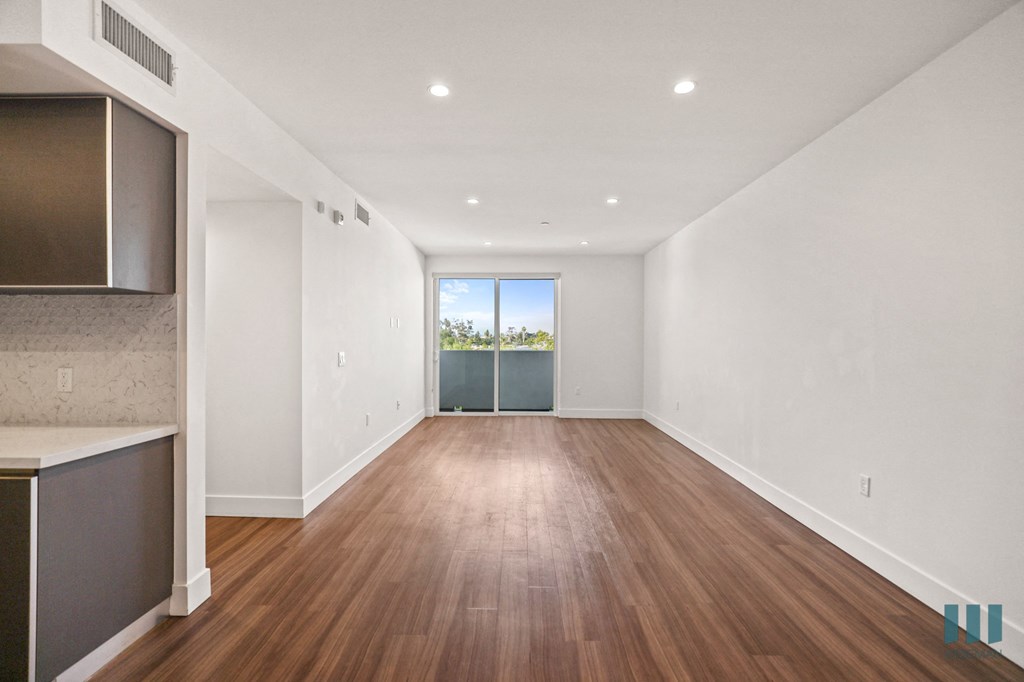 Living Room with Vinyl Flooring, Recessed Lighting, and Patio