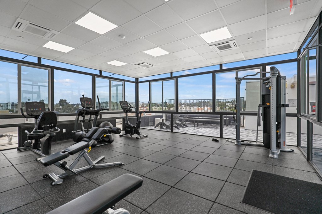 Fitness Center with Treadmill, Stationary Bike, and Elliptical Machines