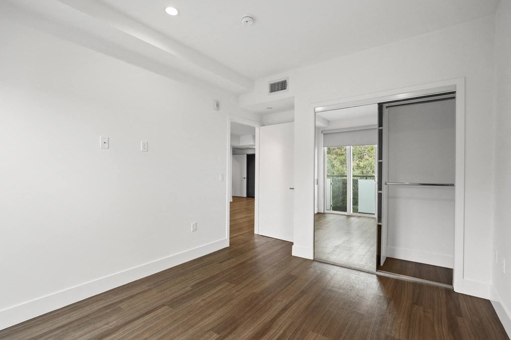 Bedroom with Mirrored Closet
