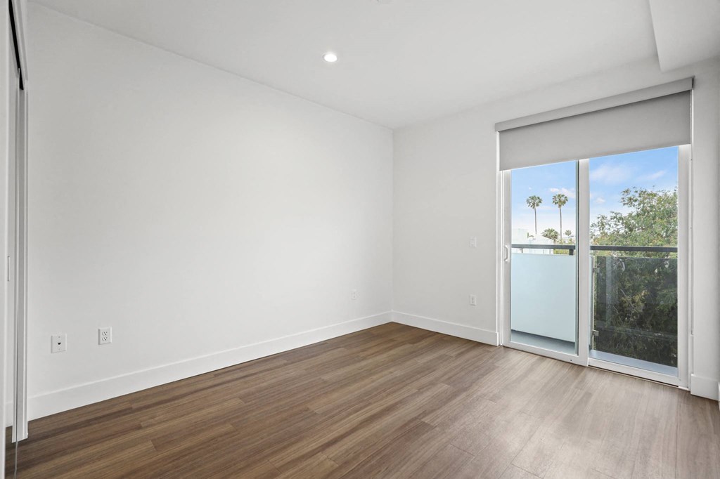 Bedroom with Balcony and Vinyl Flooring