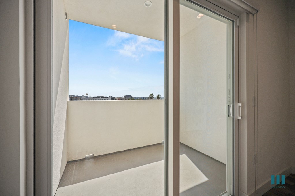 A view of the sky through a window in a room.