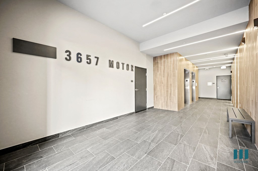 A hallway with a sign that says "3657 MOTOR" on the wall.