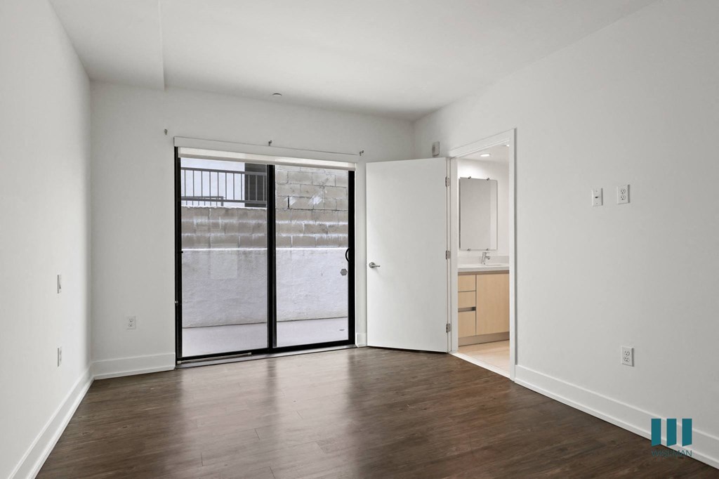 Bedroom with Vinyl Flooring, Bathroom, and Patio