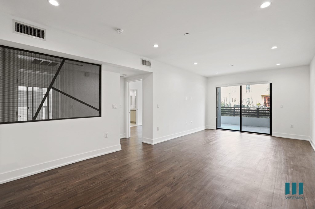 Open-Concept Dining and Living Room Areas with Patio