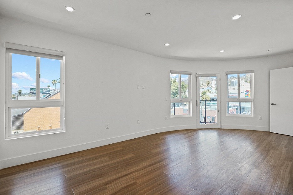 Large-Size Living Room with Recessed Lighting, Vinyl Flooring, and Patio