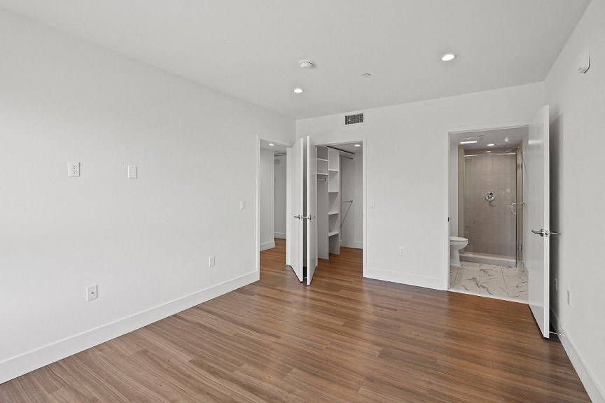 Bedroom with Bathroom and Walk-In Closet