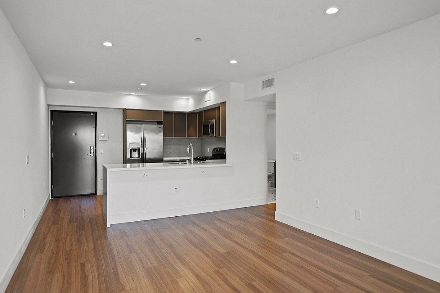 Front Entryway, Kitchen, and Dining Room Area