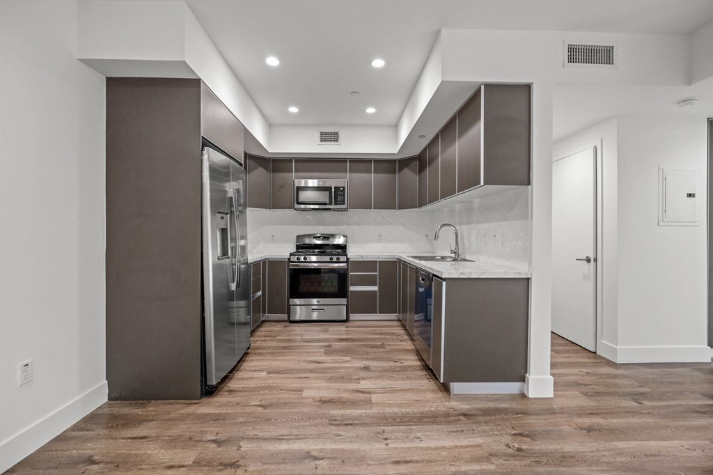 Kitchen with Energy-Efficient Appliances and Vinyl Flooring