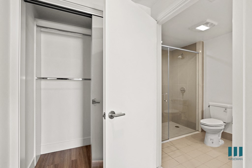 Bedroom with Hanging Closet and Bathroom with Stand-In Shower