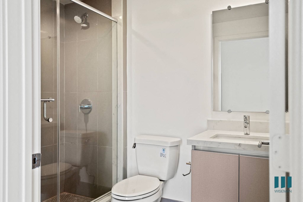 Bathroom with Stand-In Shower with Glass Door and Vanity Cabinet Storage
