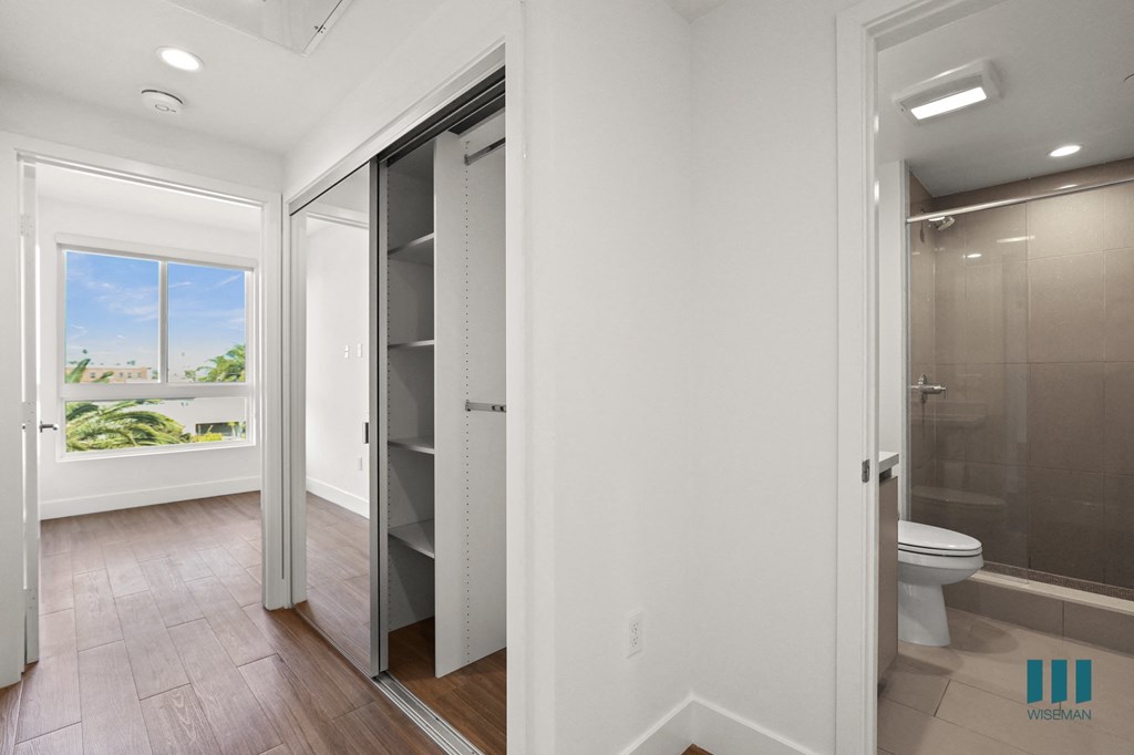 Bedroom with Bathroom and Closet with Shelving