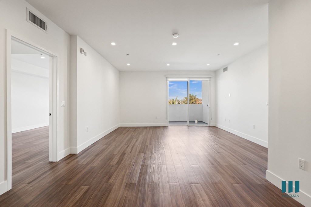 Open-Concept Dining and Living Room Areas with Patio